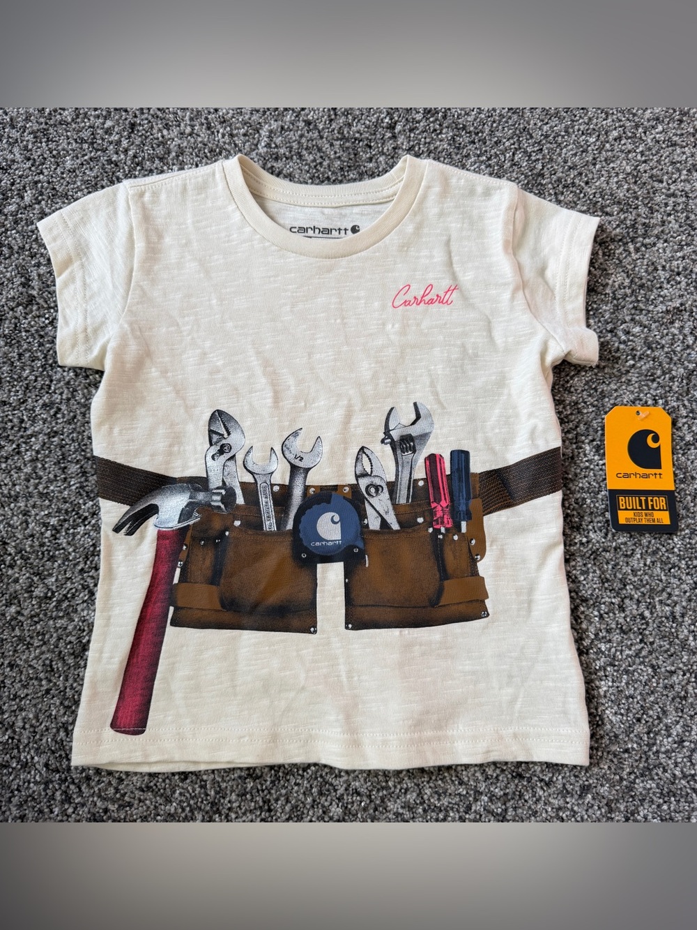 Carhartt kids t-shirt with graphic of a tool belt with various tools, size 2T